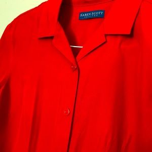 Women’s red button-up blouse, three-quarter length sleeves. Excellent condition.